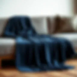 Luxurious navy blue throw draped elegantly on a modern sofa