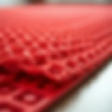 Close-up of the texture and design of a red plastic rug