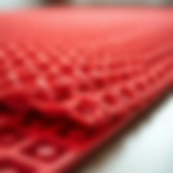 Close-up of the texture and design of a red plastic rug