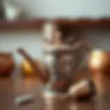 A beautifully crafted miniature watering can made from copper with intricate designs