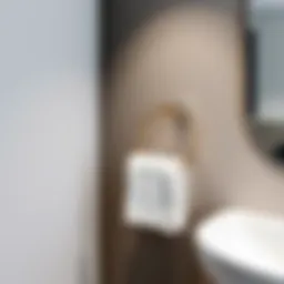 Elegant stick-on towel ring mounted on a sleek bathroom wall