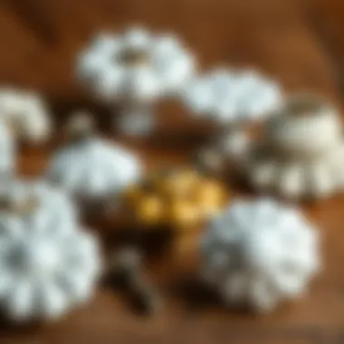A display of various styles of antique ceramic cabinet knobs on a wooden background.